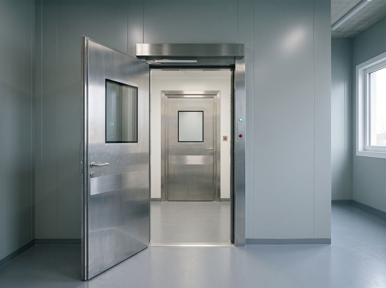 Illustrative photo: airlock and doors of a controlled area.